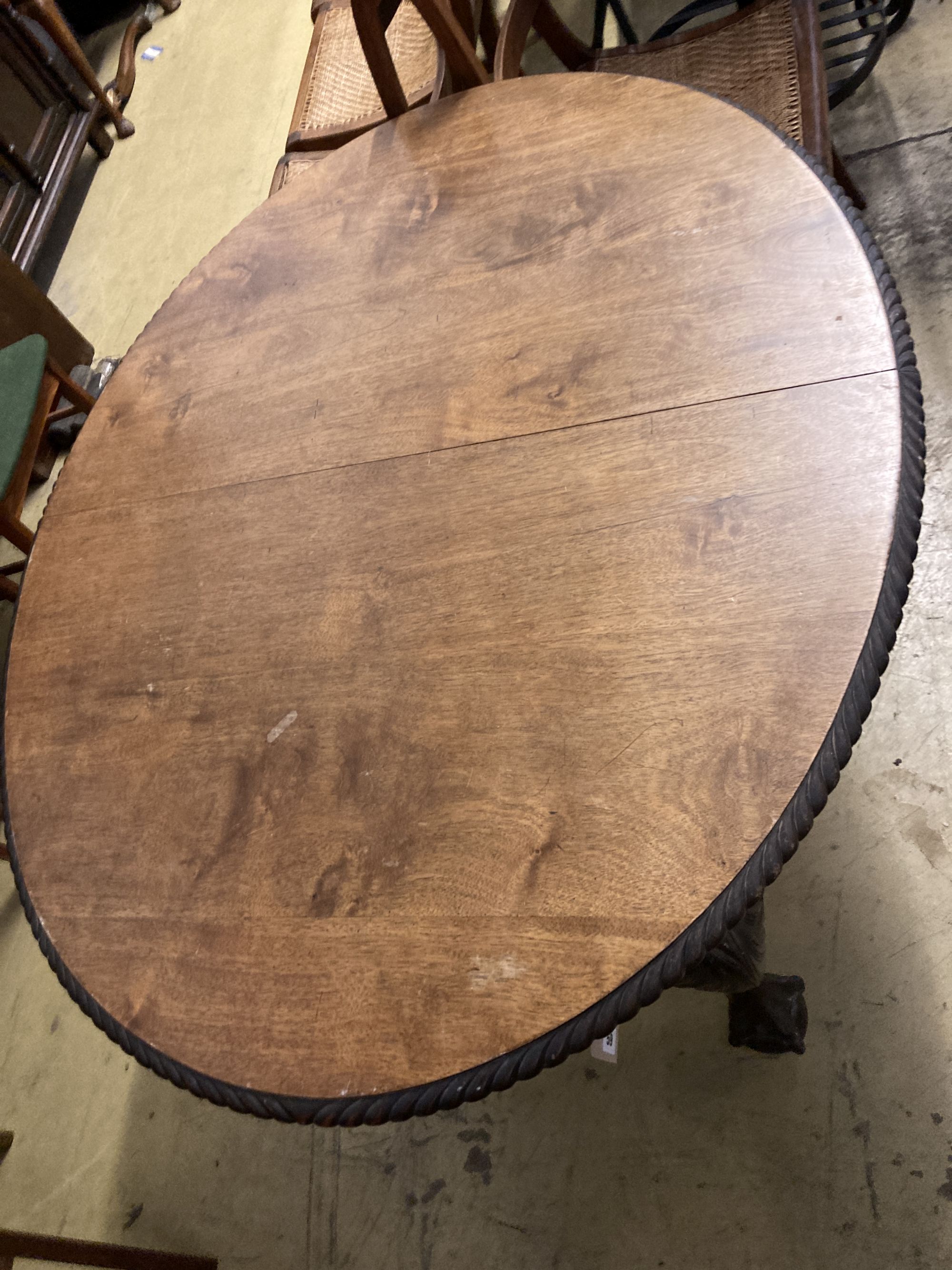 A 1920s oval extending Victorian dining table, winder, no leaves, length 132cm, depth 106cm, height 74cm